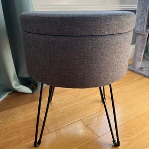 Gray Round Ottoman with Black Metal Legs